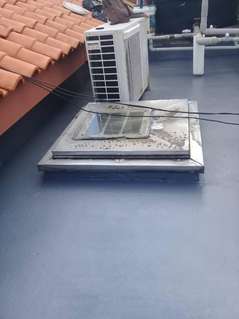 Impian Height · Roof waterproofing · Grey roof coating around the existing skylight.